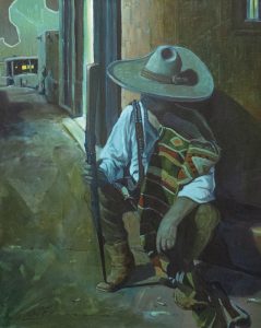 Image of older vaquero setting against wall